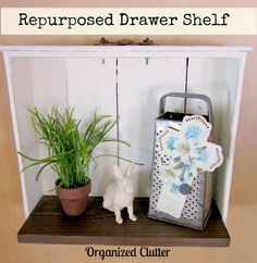 a shelf with a potted plant and an ironing board attached to it, labeled repurposed drawer shelf