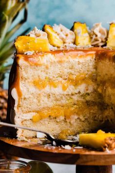 a piece of cake with pineapples and coconut on top