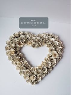 a heart made out of rolled up flowers