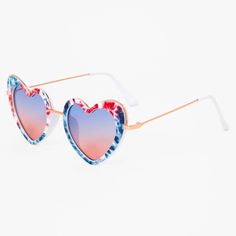 the heart shaped sunglasses are decorated with red, white and blue flowers on it's sides