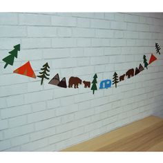 there is a bear and trees garland on the wall