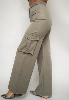 These utility cargo pants make an impact while providing a relaxed fit. Style them with statement heels or casual sneakers for a versatile look. SIZE & FIT Model is wearing a size x-small FEATURES Utility pockets Wide leg pants Hidden pant hook Zip front closure DETAILS 65% Tencel, 35% Lycra CARE Hand wash cold; Do not bleach; Line dry; Do not dry clean Trendy Khaki Bottoms With Cargo Pockets, Trendy Wide Leg Khaki Cargo Pants, Trendy Straight Pants With Multiple Pockets, Trendy Khaki Pants With Multiple Pockets, Full Length Cargo Pants For Spring, Full-length Spring Cargo Pants, Trendy High-waisted Khaki Cargo Jeans, Spring Full Length Cargo Pants, Khaki High-waisted Cargo Jeans In Utility Style