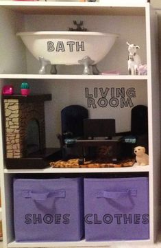 there is a shelf that has two baskets on it and the words, bathroom living room shoes clothes