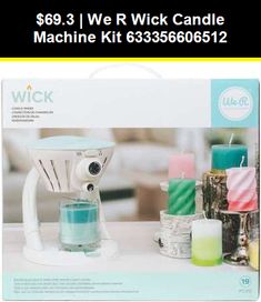 a white wick candle machine sitting on top of a table