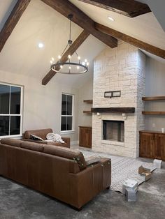 a living room with a couch and fireplace in it