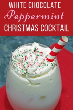 a white chocolate peppermint christmas cocktail with sprinkles and candy cane