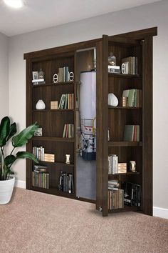 an open bookcase with several books on it in a living room next to a potted plant