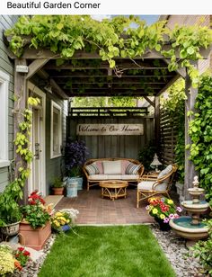 an outdoor garden with lots of flowers and greenery