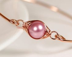 Items similar to White Pearl Bangle Bracelet Wire Wrapped Jewelry Handmade Sterling Silver or Gold Bracelet Bridal Pearl Bracelet Swarovski Pearl Jewelry on Etsy Elegant Rose Gold Metal Beaded Bracelets, Handmade Rose Gold Pearl Bracelet, Elegant Pink Gold Bangle As Gift, Adjustable Rose Gold Wire Wrapped Bracelets, Rose Gold Wire Wrapped Bracelet, Elegant Pink Wire Wrapped Bracelets, Rose Gold Bangle Bracelets For Jewelry Making, Rose Gold Bangle Pearl Bracelet As A Gift, Wire Wrapped Rose Gold Bracelet