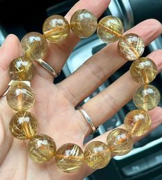 Material:gold Rutilated Quartz beads  size : 15mm   quantity: one strand  6mm approx 29 pcs one strands 7mm approx25 pcs one strands 8mm approx 22 pcs one strands 9mm approx 21pcs one strands 10mm approx 19 pcs one strands 11mm approx 18pcs one strands 12mm approx 16 pcs one strands 13mm approx 16 pcs one strands 14mm approx 15 pcs one strands 15mm approx 14pcs one strands 16mm approx 14 pcs one strands 17mm approx 13pcs one strands 18mm approx 13pcs one strands 19mm approx 12pcs one strands 20m Golden Quartz, Golden Rutilated Quartz, Citrine Jewelry, Energy Bracelets, Healing Bracelets, Quartz Bracelet, Rutilated Quartz, Natural Crystals, Colour Tone