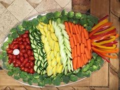 a platter filled with lots of different types of vegetables