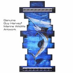 a blue and white painting on the side of a building with words genuine guy harvey marine wildlife artwork work