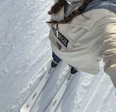 a woman on skis standing in the snow