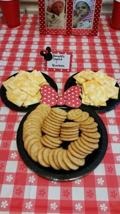 a mickey mouse plate with crackers and cheese on it