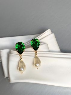 Elegant teardrop earrings featuring dark moss green tops paired with ivory crystal baroque dangles. Made with Premium Quality European Crystal. Available in gold, rose gold or silver finish. Post back.  - Measurements :    1 5/8" long from the top to the bottom of the earring    1/2" wide * RETURN POLICY - We do not accept returns for a refund as all of out items     are made to order. But please contact us if you are     having an issue with your order. - We do accept exchanges. You can exchang Green Teardrop Pearl Earrings For Wedding, Green Drop Pearl Earrings For Wedding, Green Pearl Drop Jewelry, Green Teardrop Pearl Drop Jewelry, Green Teardrop Jewelry With Pearl Drop, Green Pearl Earrings For Wedding, Elegant Green Drop Pearl Earrings, Elegant Green Pearl Drop Earrings, Green Elegant Pearl Drop Earrings