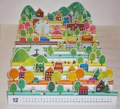 a calendar with houses and trees on it