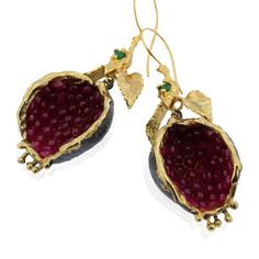 pomegranate jewelry,Pomegranate Earring,israel jewelry We have meticulously created these pomegranate-shaped earrings using 24-carat gold and black rhodium plating. The contrast between the two tones adds a unique touch to the design. Each pomegranate seed is delicately embellished with shimmering quartz stones in a captivating ruby hue, further enhancing the beauty of the earrings. The leaf on top of the pomegranate is adorned with a mesmerizing emerald gemstone, adding a touch of elegance and sophistication. These earrings are meticulously crafted from brass, ensuring durability and a luxurious feel. With a length of 2.95 inches, they provide a statement-making appearance, and the 1.18-inch drop length adds graceful movement to the design. The width of 0.787 inches ensures a comfortable Handmade Garnet Drop Earrings, Pomegranate Necklace, Pomegranate Earrings, Pomegranate Jewelry, Food Earrings, Fruit Earrings, Earring Gold, Bronze Gold, Ruby Earrings