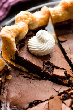 a piece of chocolate pie with whipped cream on top