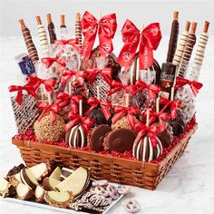 a basket filled with assorted chocolates and candies on top of a table