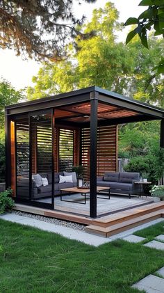 an outdoor living area with couches, tables and chairs in the middle of it