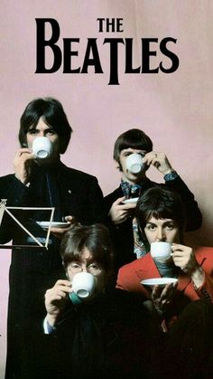 the beatles drinking coffee together in front of a pink wall