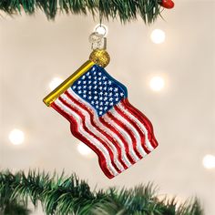 an american flag ornament hanging from a christmas tree