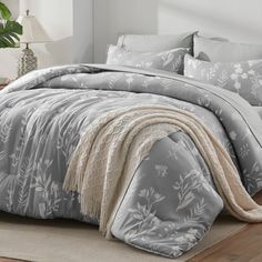 the comforter is made up and ready for someone to use it in their home