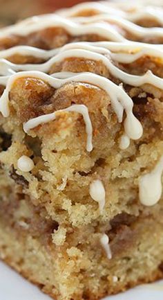 a close up of a piece of cake on a plate with frosting and icing