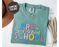 Showcase your dedication and care with Pre-school Teacher Comfort Colors shirt, perfect for staying cozy and professional. Wear to celebrate the first or last day of school, or to show your career pride in style year round!  About - Comfort Colors 1717 Crewneck Tshirts - 100% Ring-Spun Cotton - Relaxed Fit, Unisex Sizing - Direct to Garment (DTG) Printed - Ink is printed directly onto the item which results in a long lasting, slightly distressed look.  Care - For best care, we recommend apparel Back To School T-shirt With Heat Transfer Vinyl, Green Letter Print T-shirt For End Of School Year, End Of School Year Long Sleeve T-shirt, Long Sleeve T-shirt For End Of School Year, Green School Spirit Tops For School, Long Sleeve School Spirit T-shirt, Green Long Sleeve School T-shirt, Customizable School Spirit T-shirt For Back To School, Green Long Sleeve T-shirt For School