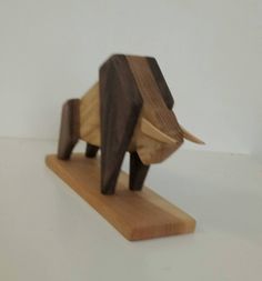 a wooden elephant figurine sitting on top of a table