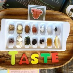 the word taste spelled out in plastic letters on a tray