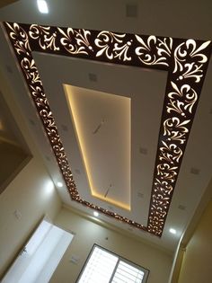 the ceiling is decorated with intricate designs and lights