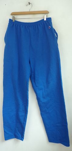 "-Description- >Champion bright blue sweatpants >elastic waist >drawstring at the waist >open bottom >size XL >awesome! >condition: great - name written on the interior tag >color(s): blue >fabric(s): 50 cotton / 50 polyester >brand: champion >care: machine wash -Measurements- >size: XL ✩ all measurements are taken with the item laying flat & some sizes are estimates so please check measurements ✩ waist: 32-35\" / 81-89cm inseam: 33\" / 84cm rise: 16\" / 4 Blue Stretch Sweatpants For Jogging, Blue Stretch Joggers For Jogging, Blue Sweatpants For Jogging, Blue Stretch Sweatpants For Sportswear, Blue Relaxed Fit Sweats For Jogging, Blue Relaxed Fit Sweats For Sports, Blue Sweatpants With Elastic Waistband For Jogging, Blue Jogging Bottoms With Elastic Waistband, Blue Jogging Pants With Elastic Waistband