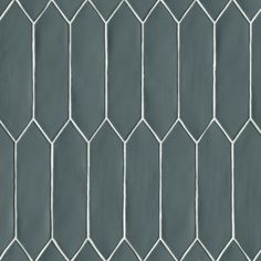 a gray tile wall with white lines on it