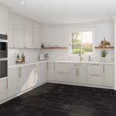 a kitchen with white cabinets and black tile flooring is shown in this rendering image