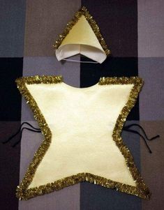 an ornament made to look like a star with gold sequins on it