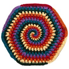 a multicolored crocheted dishcloth with a circular design on the center