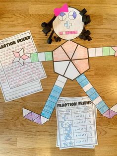 a paper doll made to look like a person with fractions and numbers on it