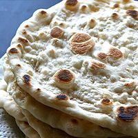 three flat breads stacked on top of each other