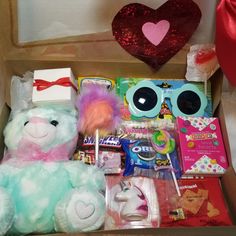 a box filled with lots of toys and other items to make it look like someones valentine's day gift