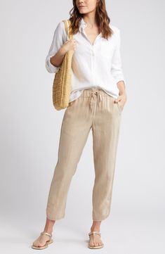 Pull-on pants with a cropped tulip hem are cut from lightweight, cool linen, which makes them ideal for sun-chasing adventures or kicked-back weekends at home. 26" inseam; 12" leg opening; 11" front rise; 16" back rise (size Medium) 24 1/2" petite inseam; 12" leg opening; 10 1/2" front rise; 15" back rise (size Medium P) Drawstring waist Front slant pockets 100% linen Machine wash, line dry Imported Effortless Spring Vacation Bottoms, Casual Linen Bottoms For Day Out, Casual Flax-colored Bottoms For Vacation, Casual Flax Colored Bottoms For Vacation, Linen Tapered Leg Pants For Day Out, Casual Neutral Bottoms For Vacation, Casual Beige Bottoms For Vacation, Casual Neutral Bottoms For Beach, Casual Neutral Beach Bottoms