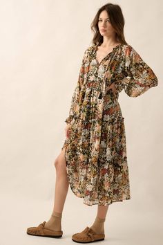 A floral-print chiffon midi dress with the following features: Deep V neckline. Long sleeves. Flared cuffs. Tiered ruffle design. Thigh length lining. Calf length. Relaxed fit. Patterned Midi Dress, Ruffle Design, Floral Print Chiffon, Chiffon Midi Dress, Floral Print Midi Dress, Autumn Dress, Prairie Dress, Chambray Dress, Work Tops