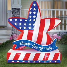 an inflatable sign with the words happy 4th of july on it and stars