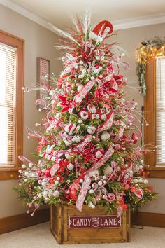 a decorated christmas tree with candy canes and bows