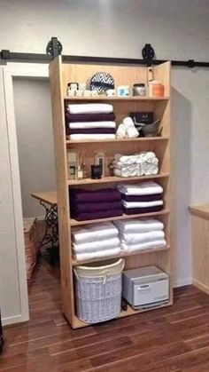 the closet is full of folded towels and other items