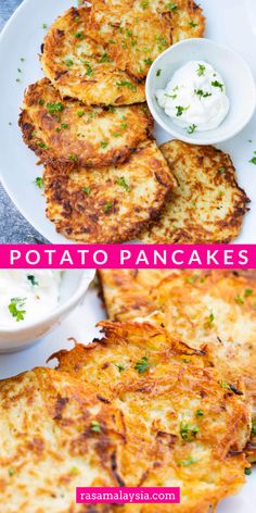 potato pancakes on a white plate with sour cream and parsley in the bowl next to them