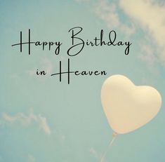 a heart - shaped balloon floating in the air with words happy birthday in heaven written on it