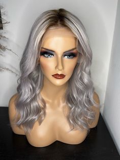 The Grey Goddess wig is a lace front with minimal plucking. She is 18" long and is 150% density (thickness). Breakdown: 13x4 Lace front  Grey with #5 root  Brazilian bodywave 18" length 150% density  Medium size cap 22.5 in (average size head) For customizations please message me! All wigs are made when you purchase them. *No REFUNDS or EXCHANGES* The Grey, Medium Size, Lace Front, Wigs, Hair Care, Lace, Grey, Hair, Beauty