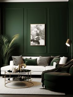 a living room with dark green walls and white couches, coffee table and chair