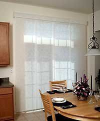 a dining room table with place settings on it